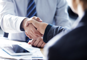 Employer and employee shaking hands