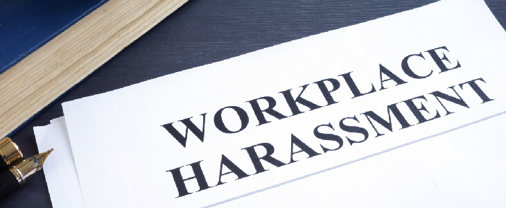 black text on paper that reads workplace harassment