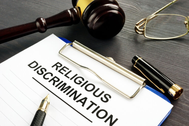 Religious Discrimination claim and pen on a table.
