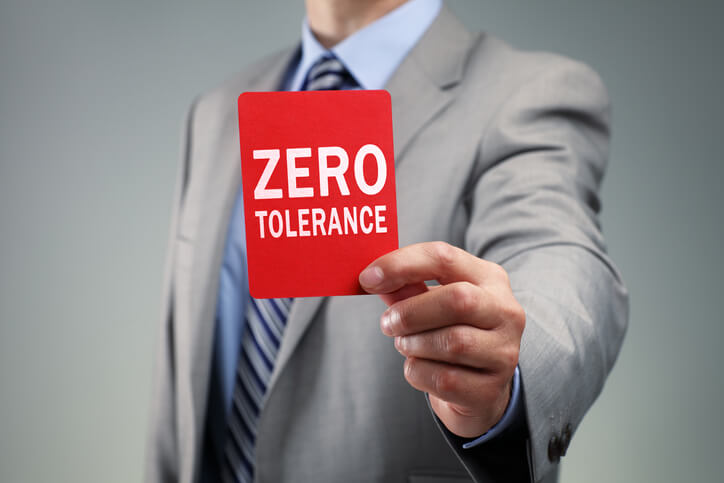 Showing a zero tolerance red card concept for bad business practice, exclusion or criminal activity