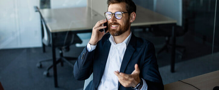 Corporate communication. Male entrepreneur talking on cellphone