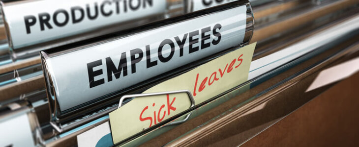 Close up on a file tab with the word employees plus a note with the text sick leaves
