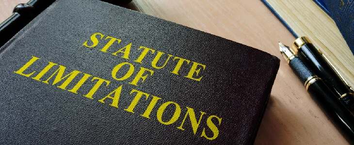 Yellow text on black book that reads Statue of limitations